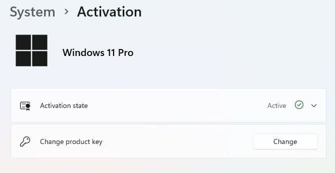Tìm đến dòng Change product key và bấm nút Change.
